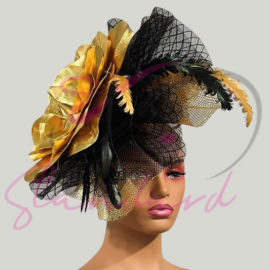 A huge metallic gold fascinator with metallic gold crinoline, black crinoline, and feathers!